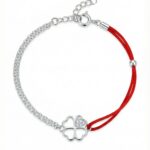 Srebrna bransoletka koniczynka na sznurku